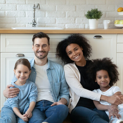 Family sitting next to a new kitchen wall