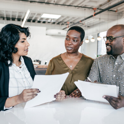 Three people disuccsing a loan